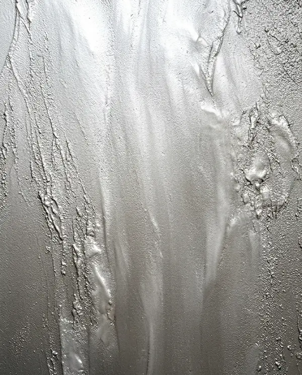 Materiaalstaal van metallic stuc in de kleur parelgrijs